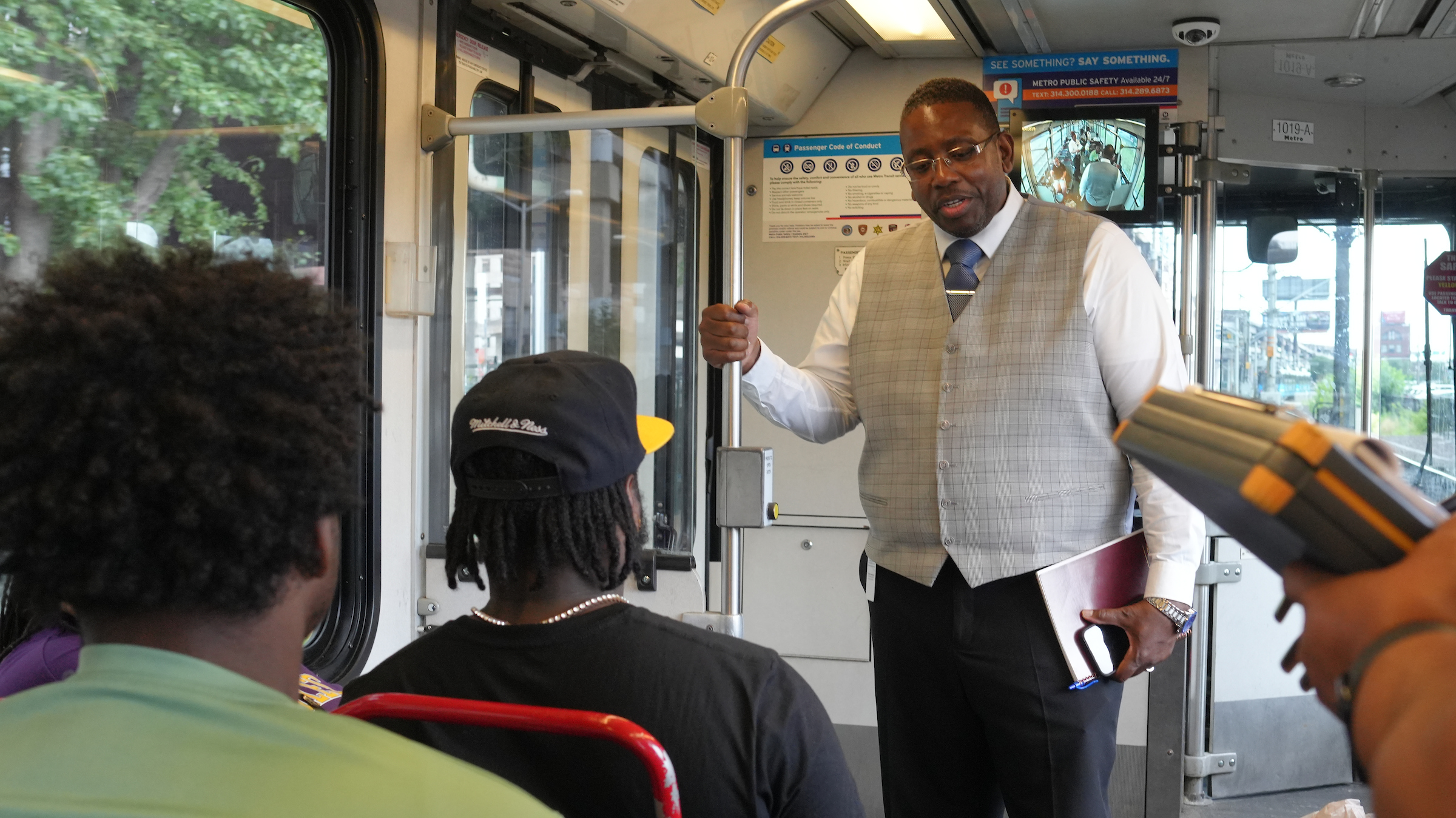 COO Ron Forrest talking to riders on a MetroLink train